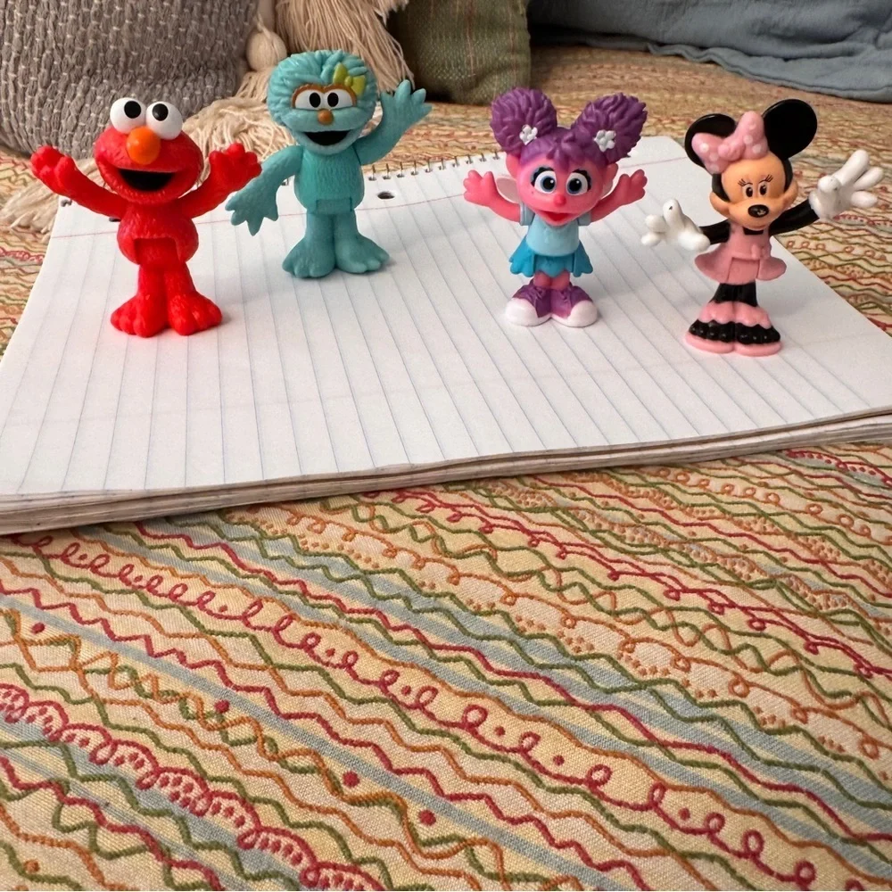 Colorful Sesame Street Neighborhood Friends and Minnie Mouse figurines